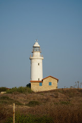 Fototapeta na wymiar Lighthouse by the sea, Paphos, Cyprus