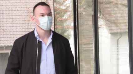 Pandemic, A man in a protective mask near a closed cafe with large glass winds. - Powered by Adobe