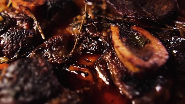 Delicious ossobuco in a pan, close up. Traditional Italian food.