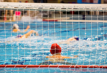 Water-polo match with goalkeeper in gate