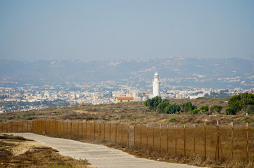 Fototapeta na wymiar Lighthouse by the sea, Paphos, Cyprus