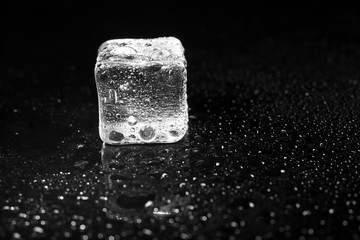 ice cubes on black table background.