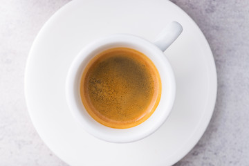 Espresso coffee in a white ceramic cup