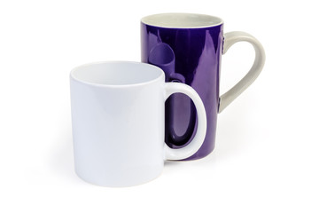 Two different empty cups with handles on a white background