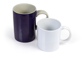 Two empty cups different colors and sizes on white background