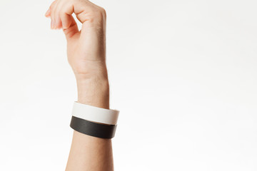 Black and white version of blank bracelet on hand. Paper festival branding wristband, mockup.