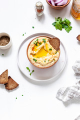 Chickpeas hummus with toasted bread, olive oil and paprika