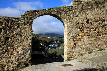 Cervo (IM), Italy - December 30, 2017: A stone wall with an arc in Cervo village, Italian Riviera,...