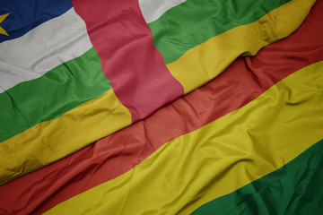 waving colorful flag of bolivia and national flag of central african republic.