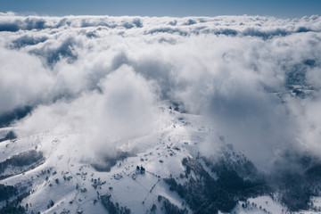 Romania above the clouds. Severe snowy weather in winter time