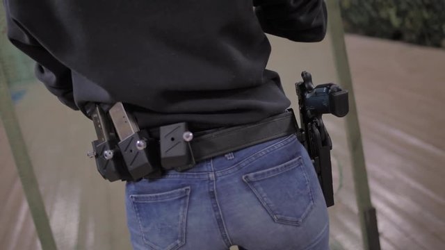 Ammunition belt with gun girl in black clothes