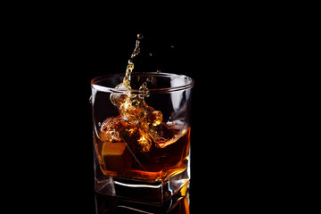 Whiskey splash in glass