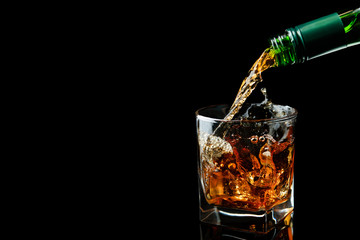 Scotch whiskey is poured into a glass
