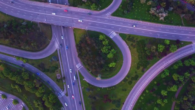 Aerial shot of a cloverleaf conjunction. Urban space transportation design