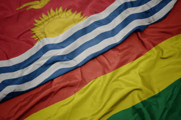 waving colorful flag of bolivia and national flag of Kiribati .