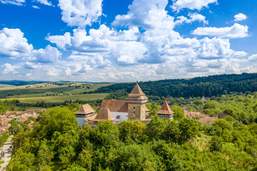 Fototapeta premium Summer landscape aerial view in Romania at Viscri fortified churh and traditional saxon village
