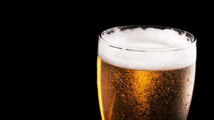 Glass of fresh beer isolated