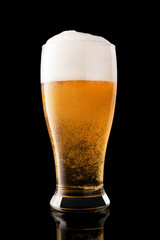 Glass of fresh beer isolated