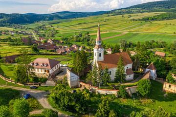 Deutsch Kreuz village Crit aerial view with fortified Church in Transylvania, Romania