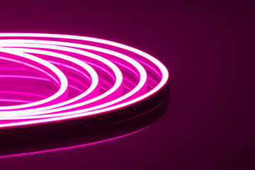 Flexible purple LED neon strip on black background