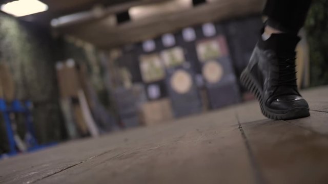 Camera on the floor, first-person view, a girl in black clothes is walking, killer