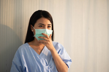 Asian patient woman wearing mask protect virus from sickness in hospital