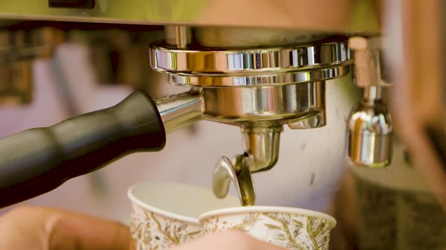 Slow motion mixed shots of making fresh espresso in a coffee shop in the morning