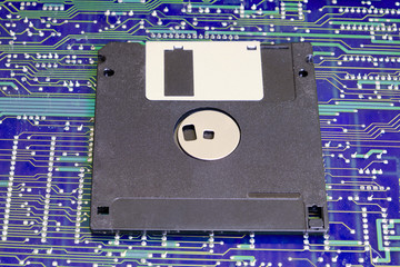 Floppy disk against electronic circuit board