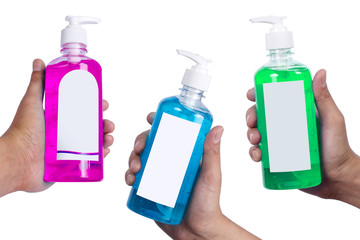 Hand holding Colorful Alcohol cleaning  gel bottle for washing hands isolated on white background.