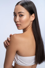 Beautiful young woman is looking to the camera