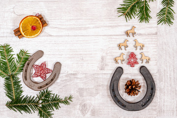 Fototapeta na wymiar Christmas arrangement of decorations for equestrian themed greetings postcards