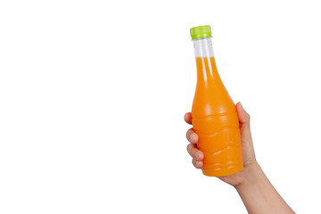 hands holding  Orange juice bottle isolated on white background.