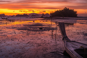 Bloody sunrise with long tail boat at Koh Yao Noi, Thailand