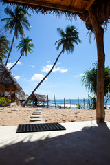 beach with trees, sea and bungalow