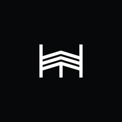 Minimal elegant monogram art logo. Outstanding professional trendy awesome artistic HM MH initial based Alphabet icon logo. Premium Business logo White color on black background