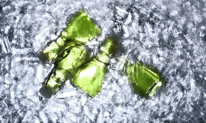 Lots of absinthe bottles in ice bucket.under table view.green alcohol.Abstract background.