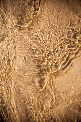 Closeup of beach, water