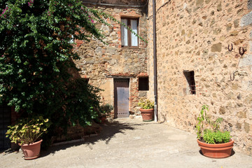 Fototapeta na wymiar Montemerano (GR), Italy - September 11, 2017: A typical house in Montemerano village, Manciano, Grosseto, Tuscany, Italy, Europe