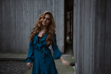 Fototapeta premium Beautiful woman with blonde long hair and blue eyes wanders the streets of Istanbul and poses for the camera