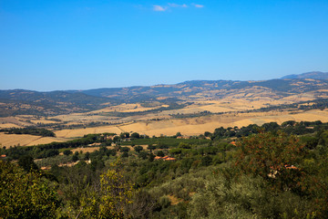 Naklejka premium Montemerano (GR), Italy - September 11, 2017: Hills landscape and country around Montemerano village, Manciano, Grosseto, Tuscany, Italy, Europe