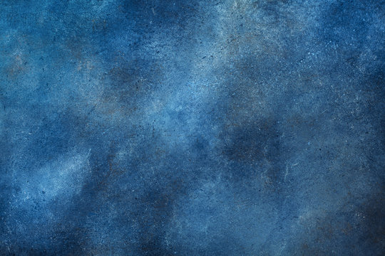 Texture of navy blue color painted wall background.