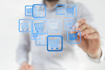 Businessman pressing modern technology panel shopping cart web phone credit card.