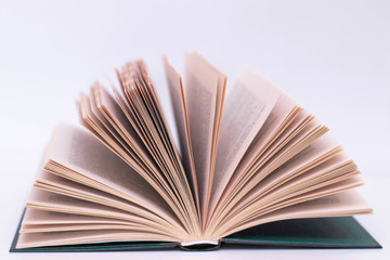 Open book on a white background, isolate. Object for design. Interest in reading, learning