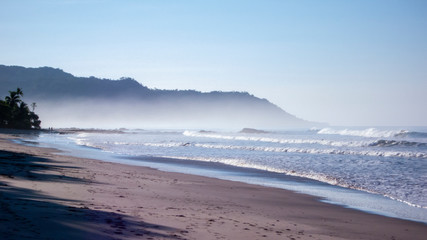 misty sunset over the beach and sea