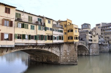 Fototapeta na wymiar Florence old Italian town medieval buildings urban panorama beautiful cityscape water bridge sky background
