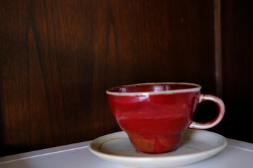 cup of coffee on wooden table