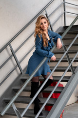 Beautiful woman with blonde long hair and blue eyes wanders the streets of Istanbul and poses for the camera