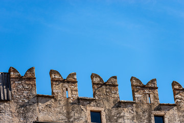 Castello del Buonconsiglio or Castelvecchio Medieval castle in Trento city. Closeup of crenellations with the arrow slits or loophole. Trentino Alto Adige, Italy, Europe