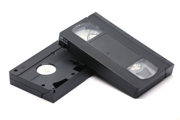 Old VHS black video cassette isolated on a white background