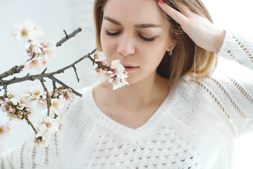 A woman is allergic to spring flowering. Sick woman. 